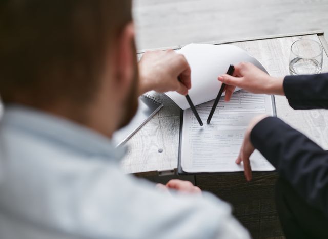 Photo by Mikhail Nilov: https://www.pexels.com/photo/close-up-shot-of-people-looking-at-the-document-on-the-clipboard-7735694/